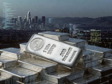 Stacked one-kilo silver bars against a city skyline